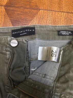 Sanctuary Vacation Crop High-Rise Flare Pants in Faded denim Olive Green